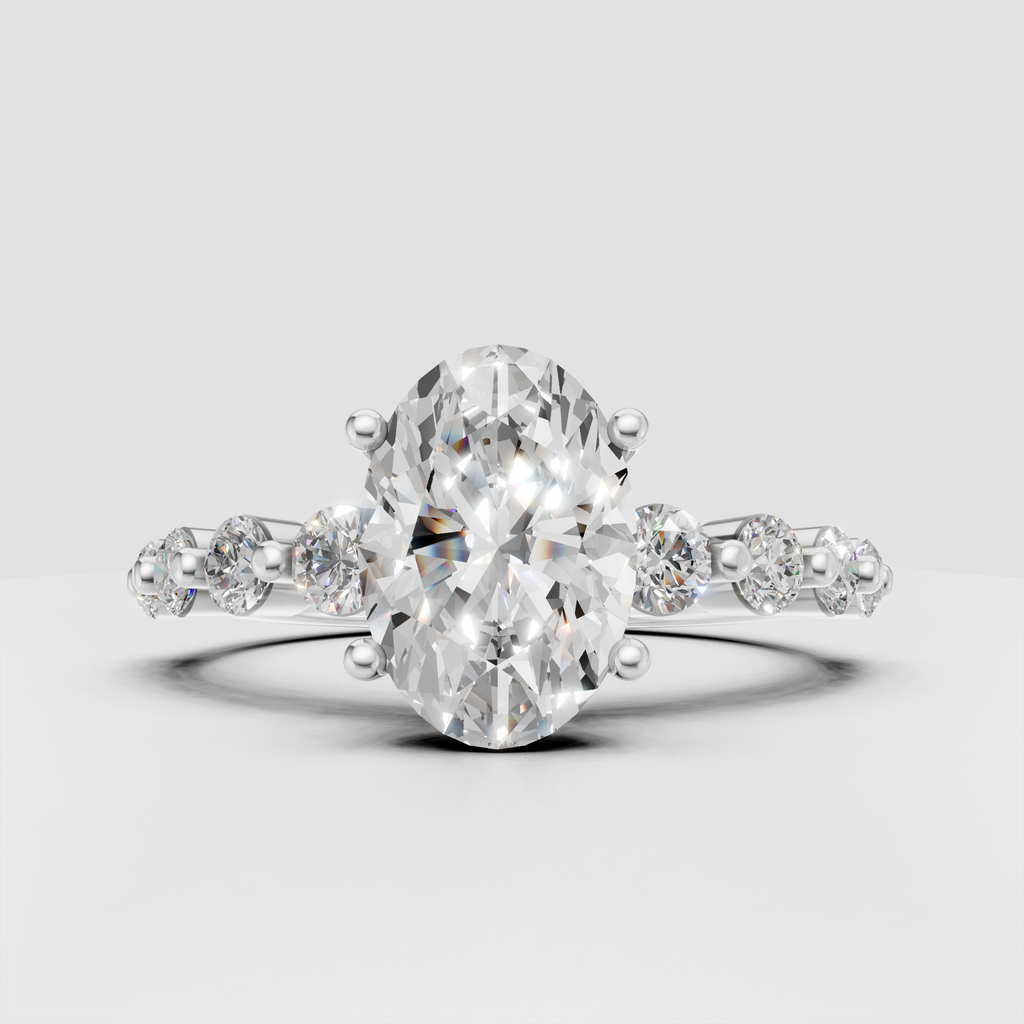 Elegant oval cut diamond ring with polished yellow gold band and side stones