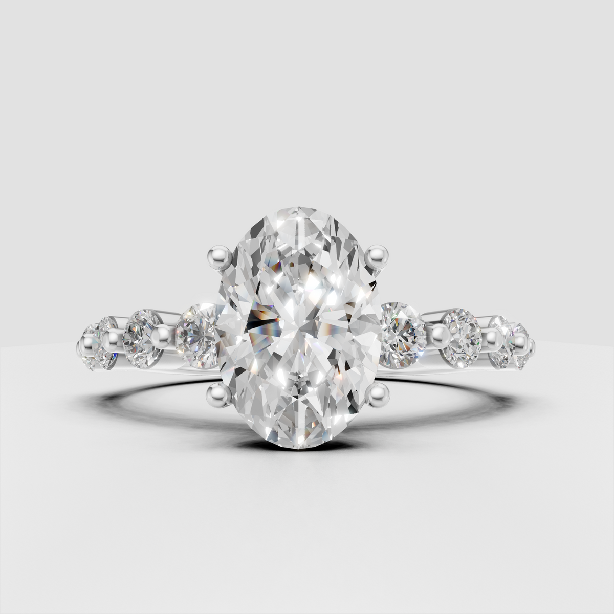 Elegant oval cut diamond ring with polished yellow gold band and side stones