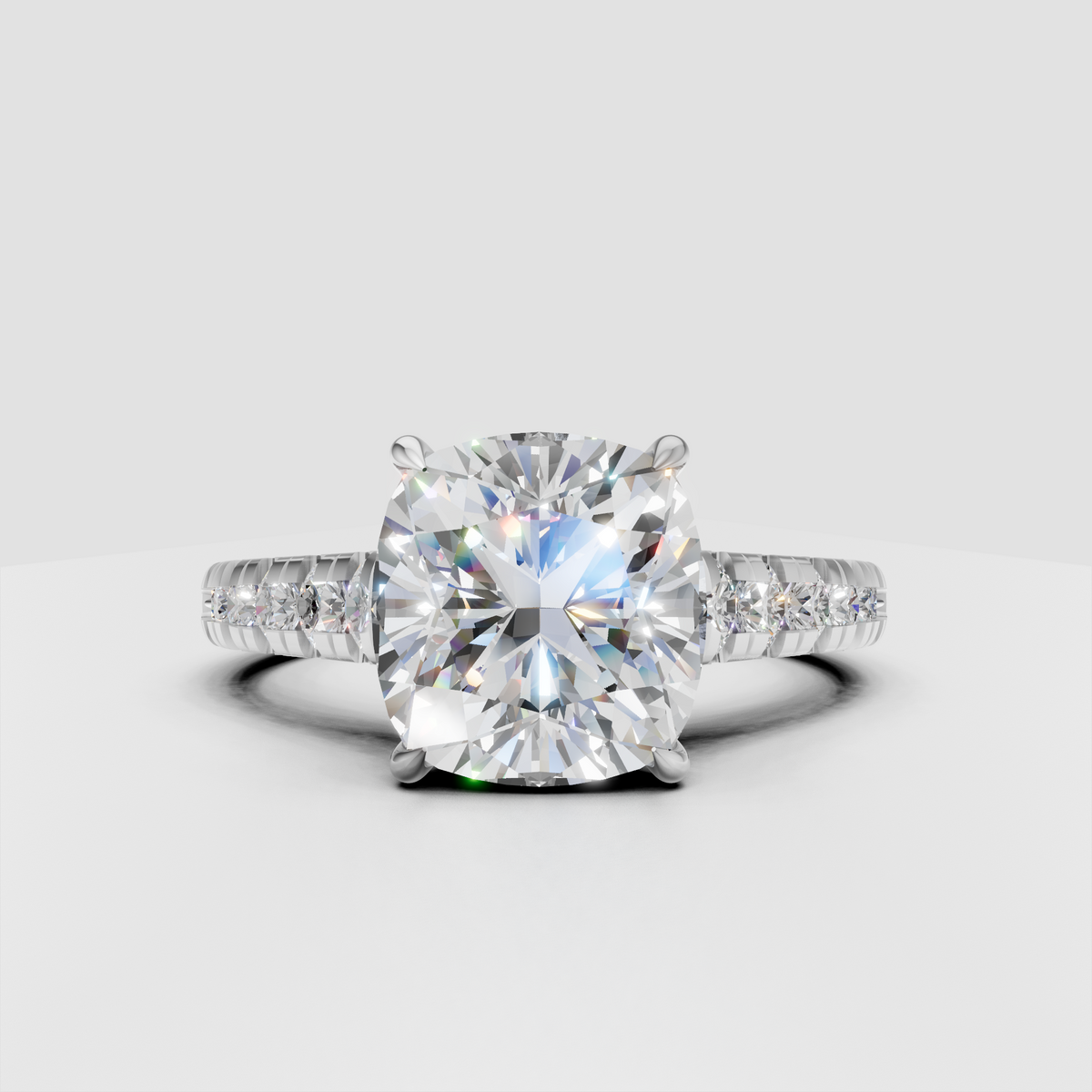 Cushion diamond ring featuring sparkling round side stones