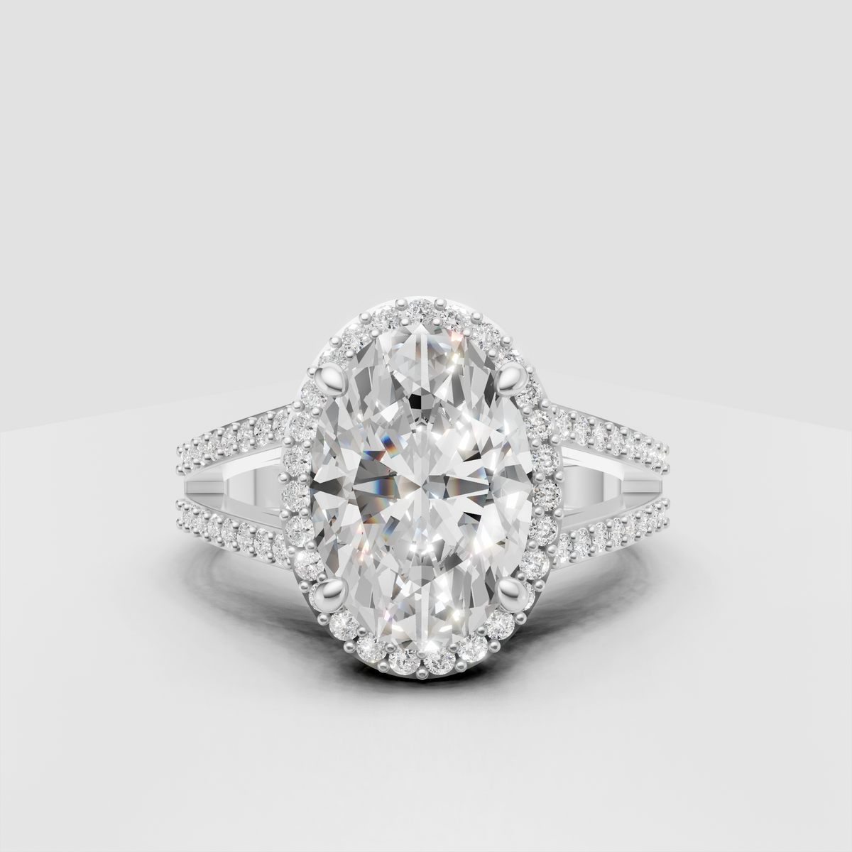 Front view of an oval diamond engagement ring in yellow gold.