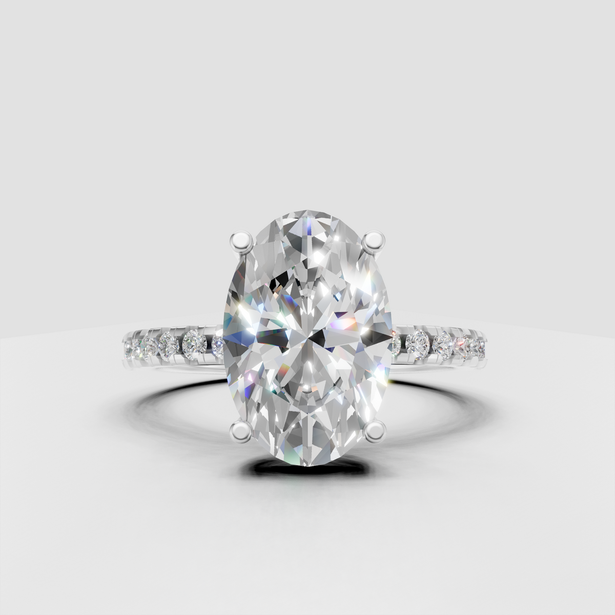 Oval center diamond ring with round diamond shoulder accents