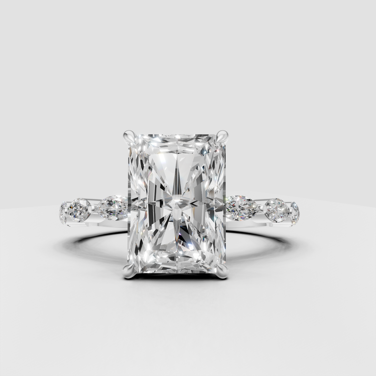 Radiant diamond engagement ring with marquise accent stones