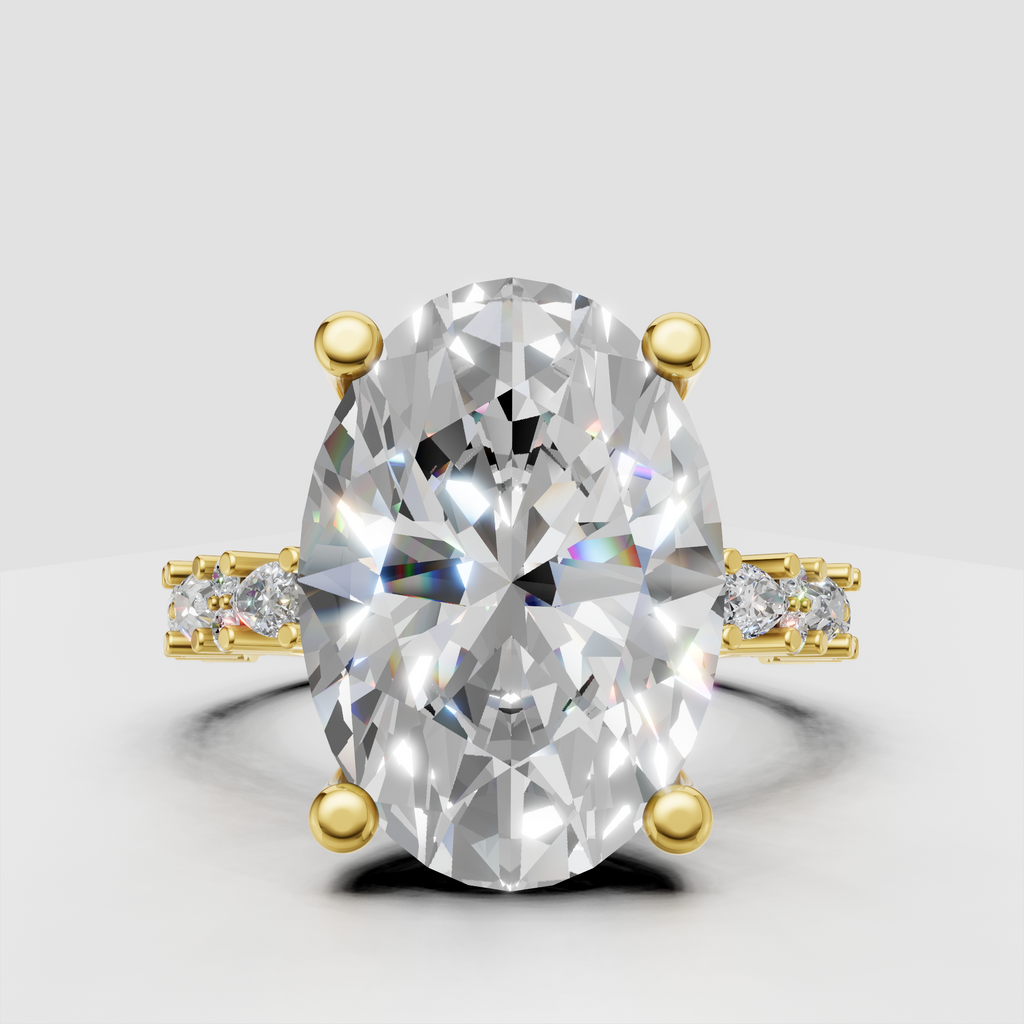 Oval diamond engagement ring with pear and round diamond accents in yellow gold