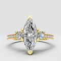 Marquise cut diamond engagement ring with yellow gold prong setting