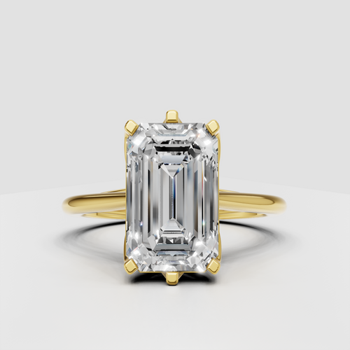 Emerald cut diamond solitaire engagement ring in polished yellow gold