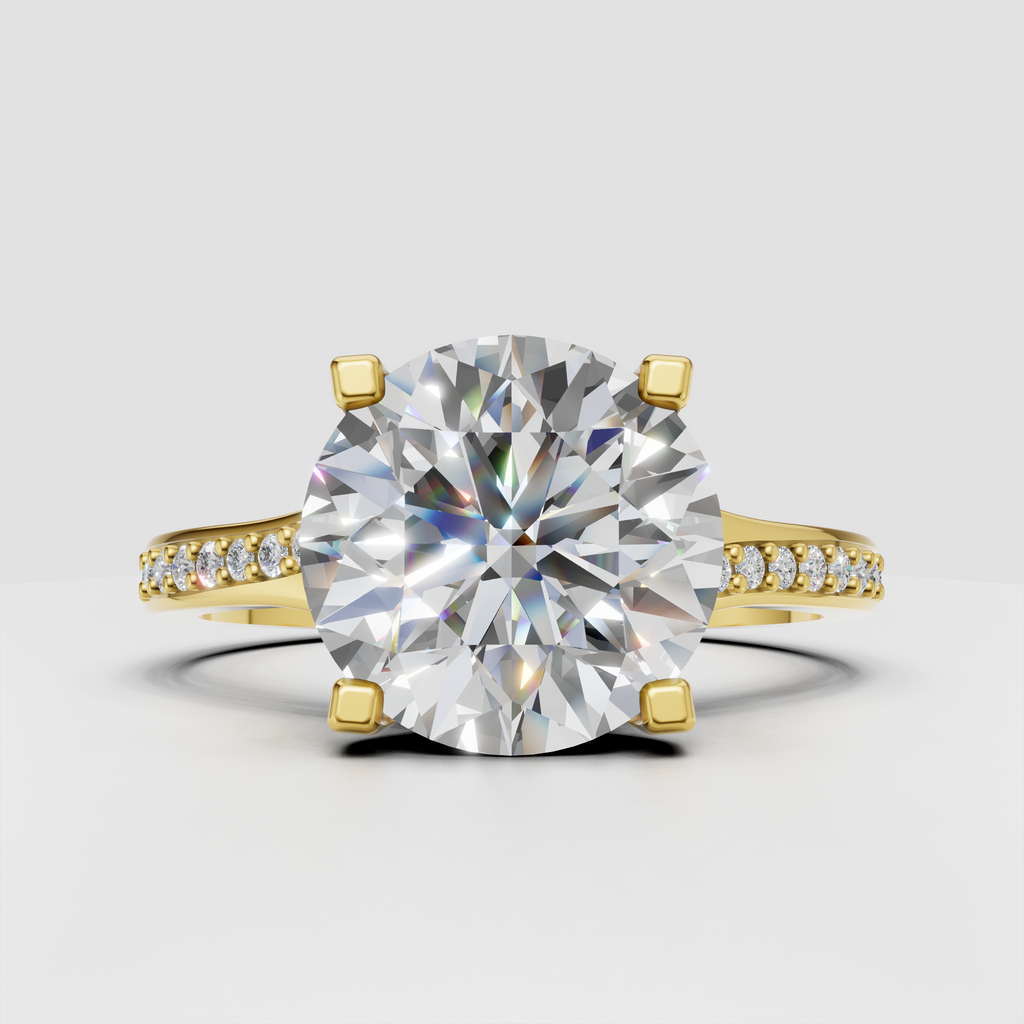 Round diamond cathedral engagement ring with pavé yellow gold band