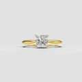 Princess cut diamond solitaire engagement ring in polished yellow gold