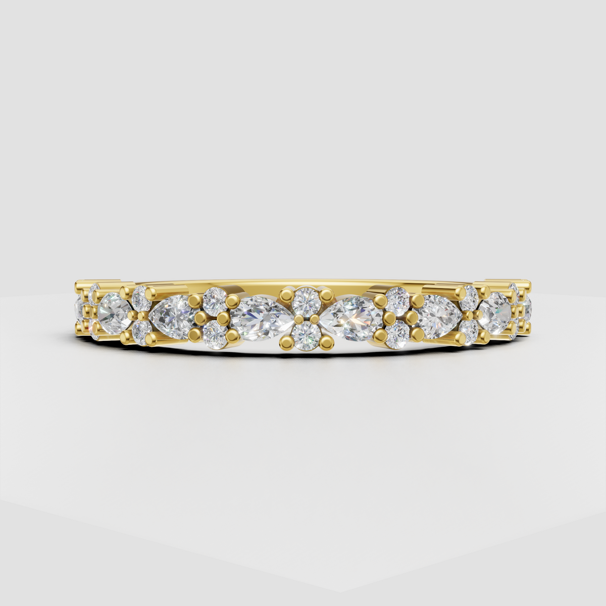 Pear and round cut diamond band in yellow gold