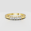 Princess cut diamond five-stone ring in polished yellow gold with shared-prong setting