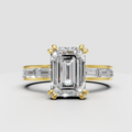 Emerald cut diamond engagement ring with baguette side stones in yellow gold