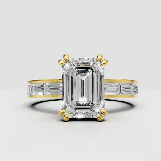 Emerald cut diamond engagement ring with baguette side stones in yellow gold
