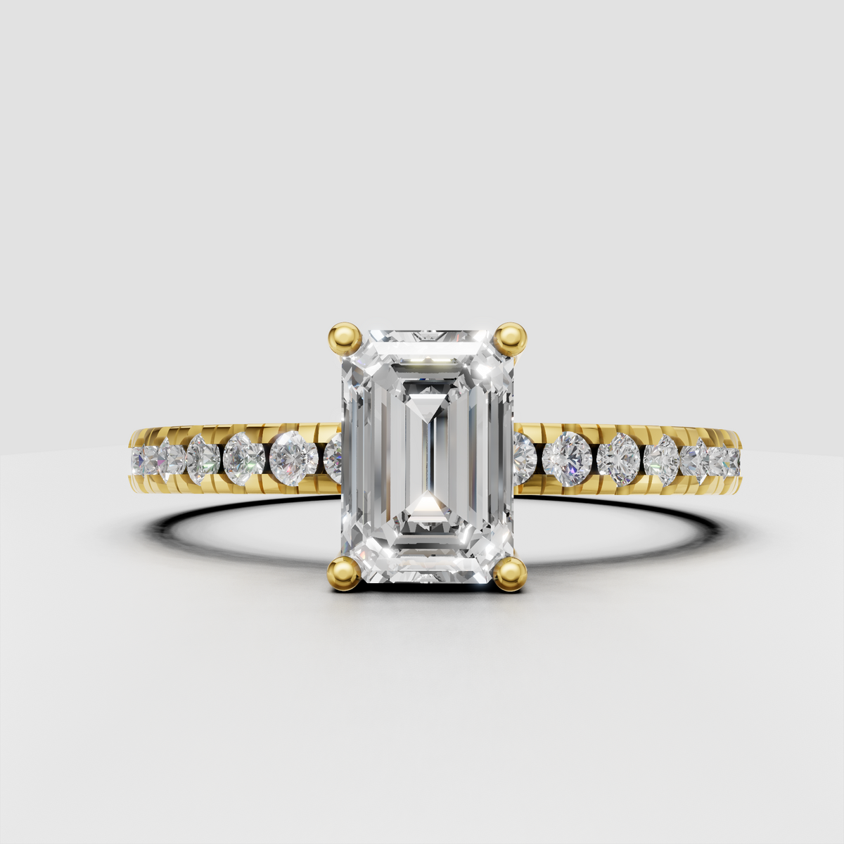 Emerald cut diamond engagement ring with four-prong setting and half eternity pave band