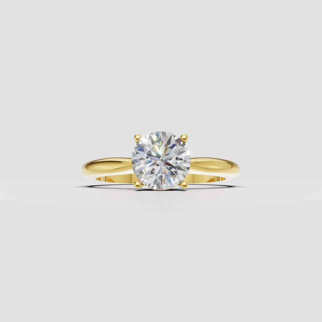 Round cut diamond solitaire ring with four prong setting and polished yellow gold band