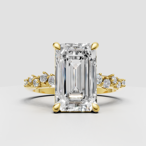 Emerald cut diamond four-prong engagement ring in yellow gold