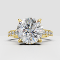 Round diamond crossover engagement ring with four-prong setting