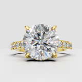 Round diamond crossover engagement ring with four-prong setting