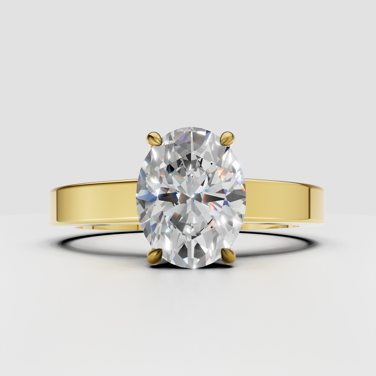 Oval solitaire diamond engagement ring in yellow gold