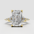 Emerald cut split shank diamond ring in yellow gold