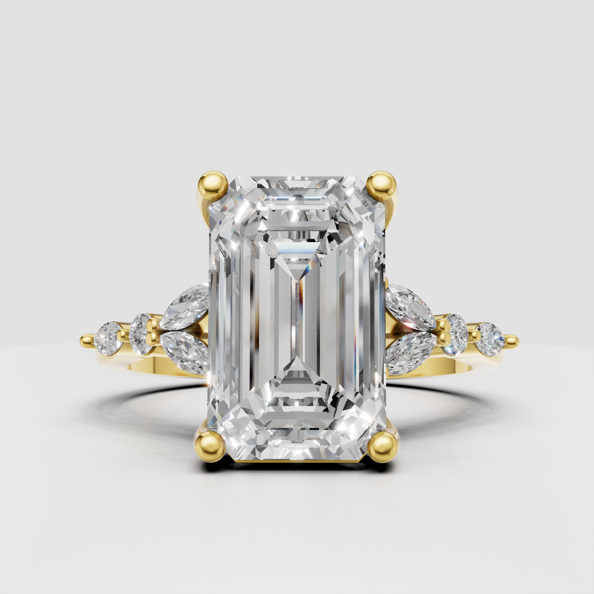 Emerald cut split shank diamond ring in yellow gold