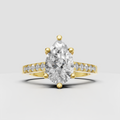 Pear cut diamond engagement ring with V-shaped split shank and round diamond accents