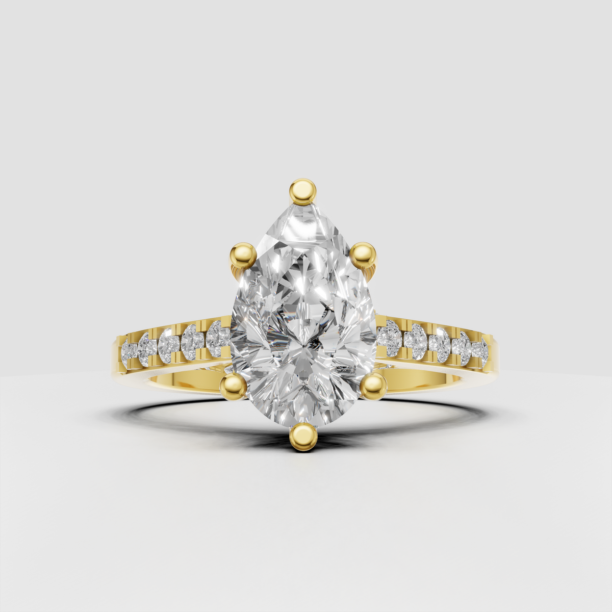 Pear cut diamond engagement ring with V-shaped split shank and round diamond accents