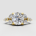 Round diamond cluster engagement ring with marquise side stones in polished yellow gold