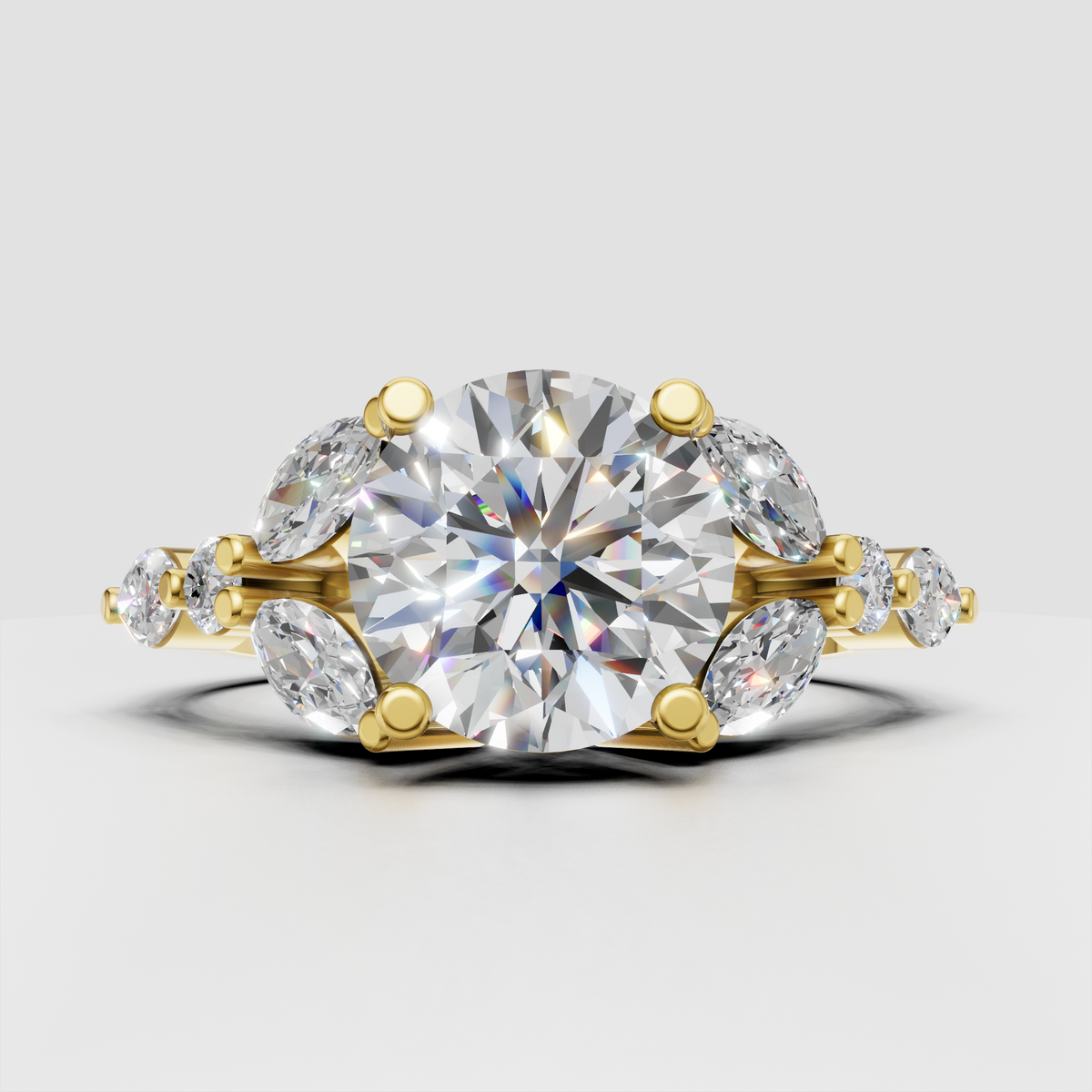 Round diamond cluster engagement ring with marquise side stones in polished yellow gold