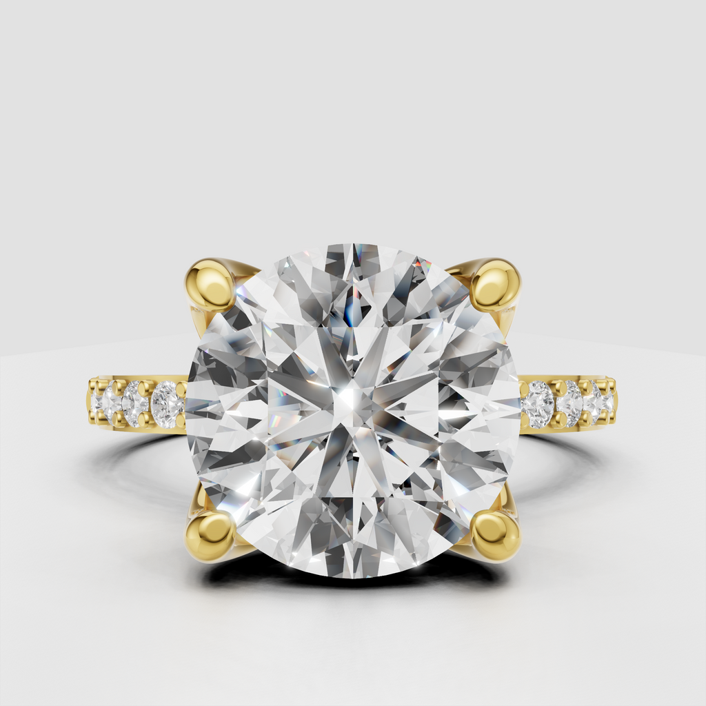 Round brilliant Diamond four-prong pavé cathedral engagement ring in yellow gold