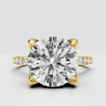 Round brilliant Diamond four-prong pavé cathedral engagement ring in yellow gold