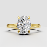 Oval diamond hidden halo engagement ring in polished yellow gold