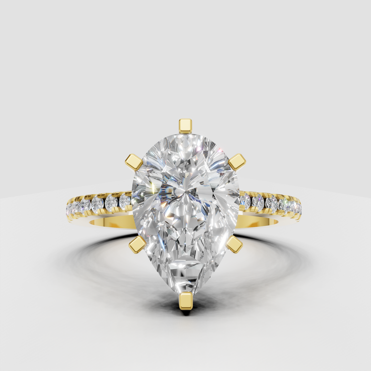 Pear cut diamond solitaire ring with accent diamonds