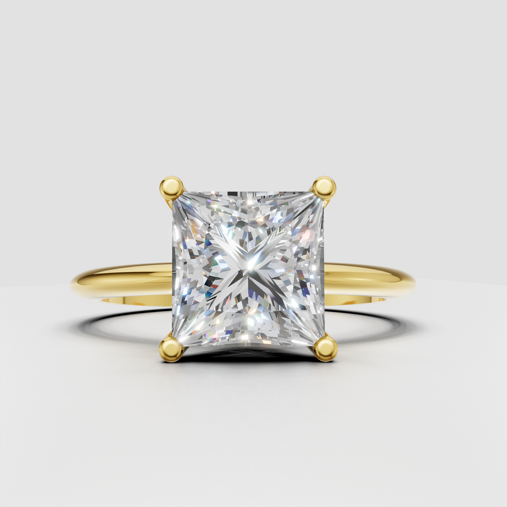 Princess cut diamond solitaire engagement ring with four prong setting and polished gold band