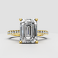 Emerald cut diamond pavé engagement ring in polished yellow gold