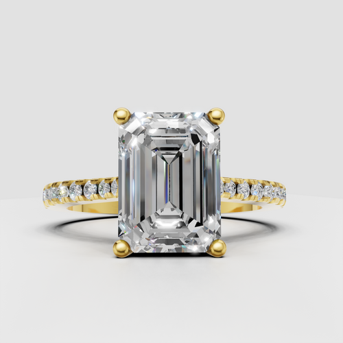 Emerald cut diamond pavé engagement ring in polished yellow gold