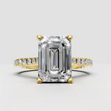 Emerald cut diamond pavé engagement ring in polished yellow gold