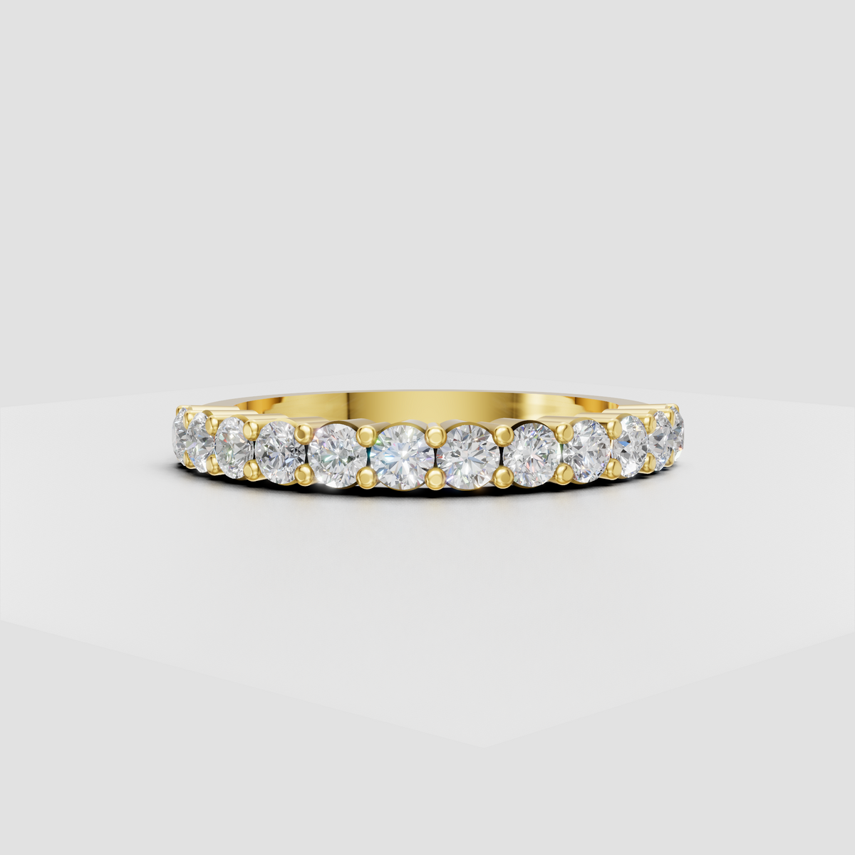 Round diamond eternity band in polished yellow gold with bead-set detailing  