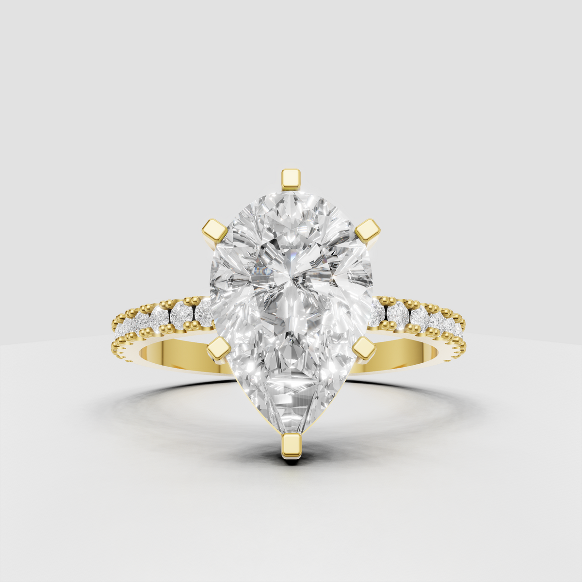 Pear-shaped diamond engagement ring in polished yellow gold with six-prong setting