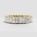 Emerald cut diamond eternity band in polished yellow gold