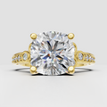 Cushion diamond prong vintage engagement ring in polished yellow gold