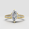 Marquise diamond pavé cathedral engagement ring in yellow gold