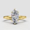 Marquise cut diamond engagement ring in yellow gold