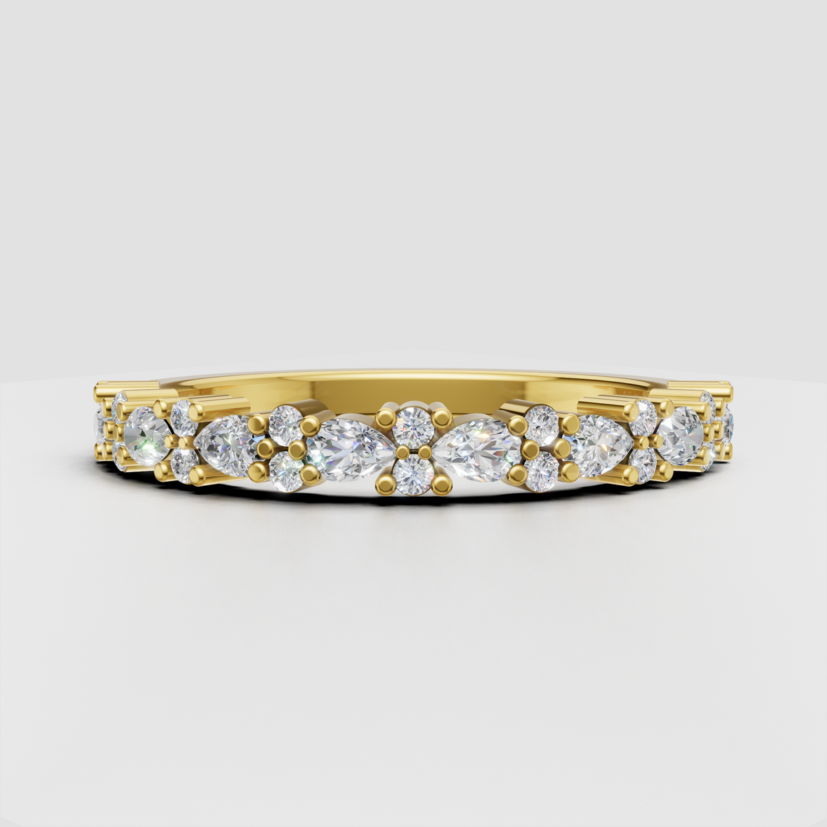 Round and pear cut diamond wedding band in polished yellow gold