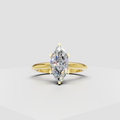 Marquise cut diamond eternity ring in polished yellow gold with shared prong setting