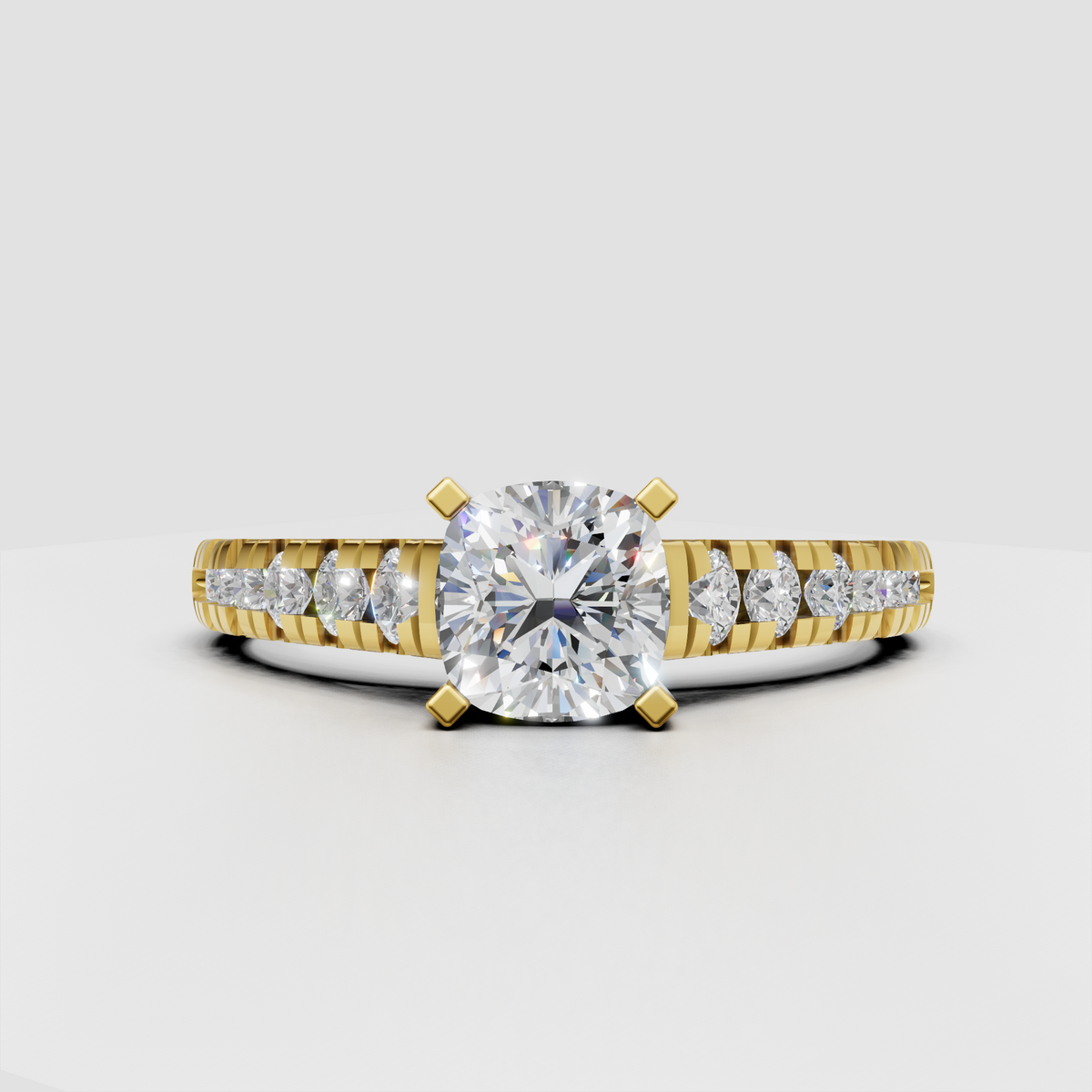Cushion cut diamond ring with graduated round side stones in yellow gold