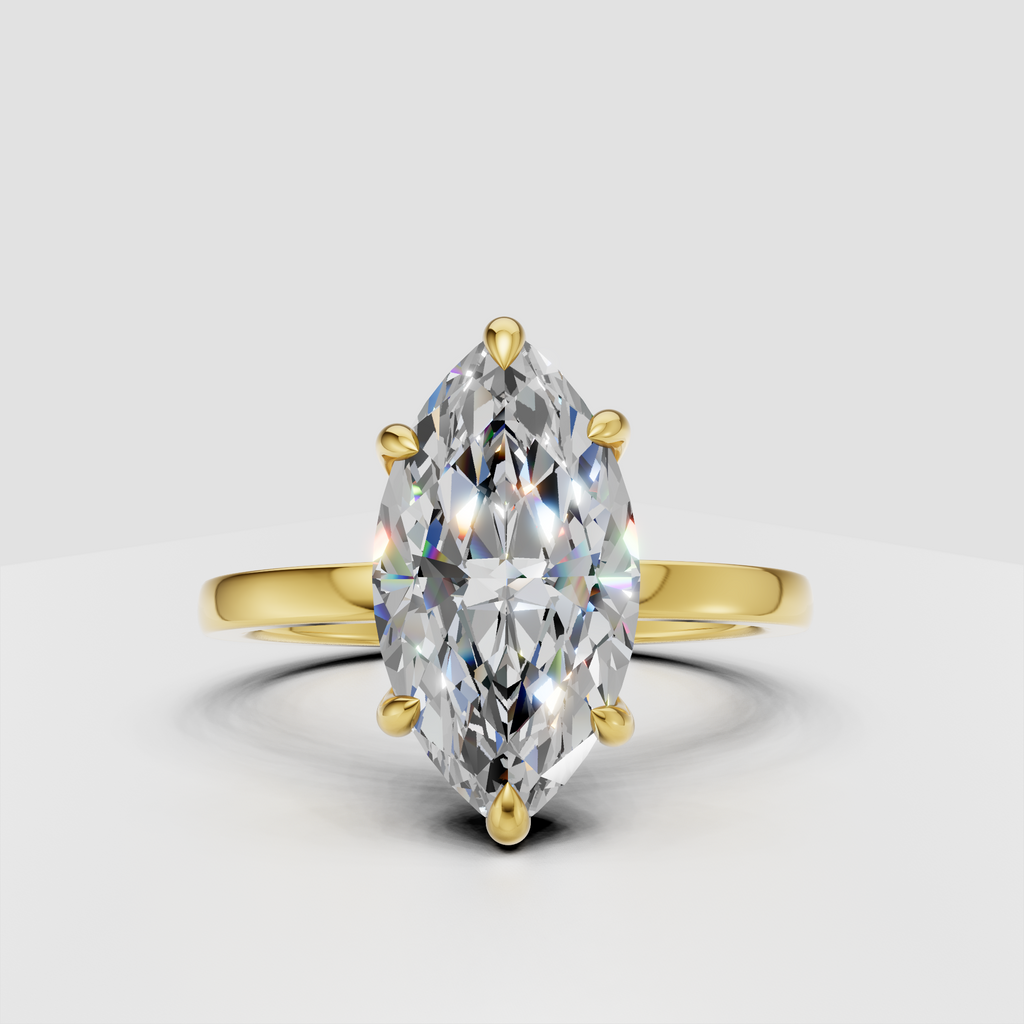 Marquise cut diamond solitaire engagement ring in polished yellow gold