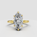Marquise cut diamond solitaire engagement ring in polished yellow gold
