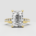 Radiant cut diamond hidden halo engagement ring with rose gold pavé band