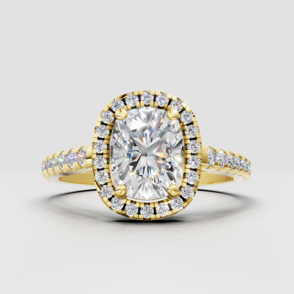 Cushion cut diamond halo engagement ring in yellow gold