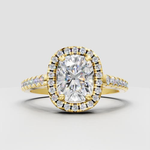 Cushion cut diamond halo engagement ring in yellow gold