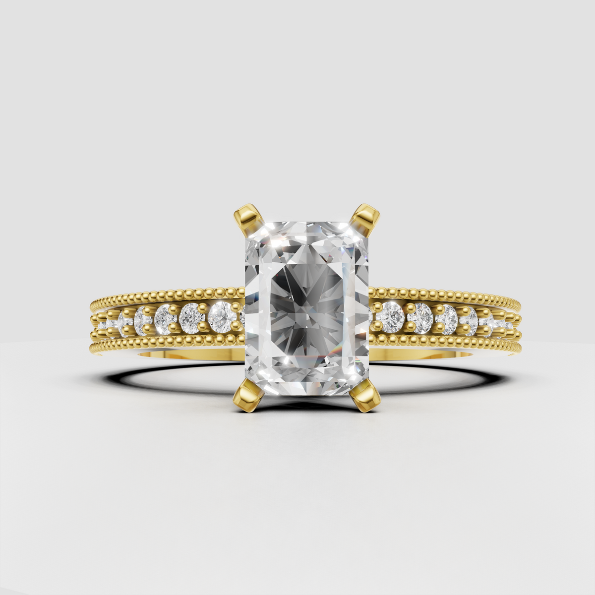 Radiant cut diamond engagement ring with four-prong gold setting and milgrain band